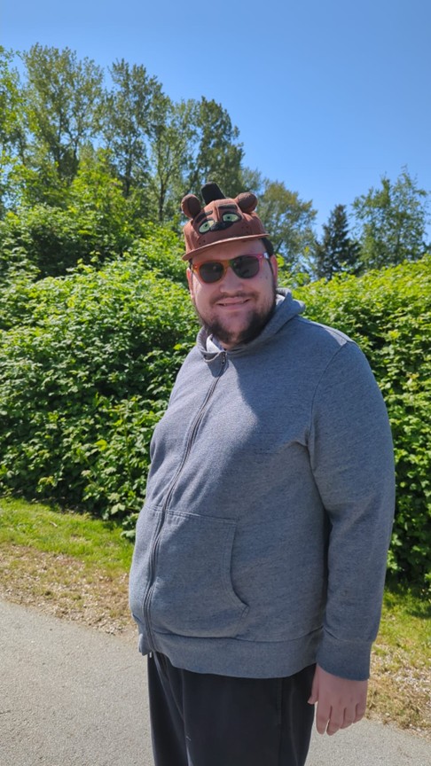 Stuart Smiling and wearing a funny hat