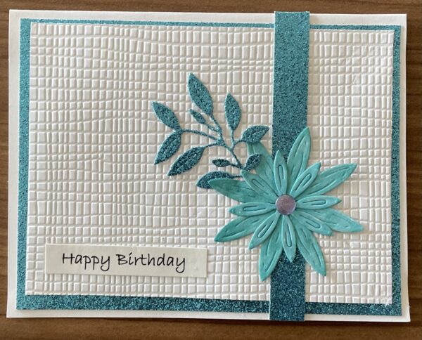 Happy Birthday card with white background, blue and teal flowers.