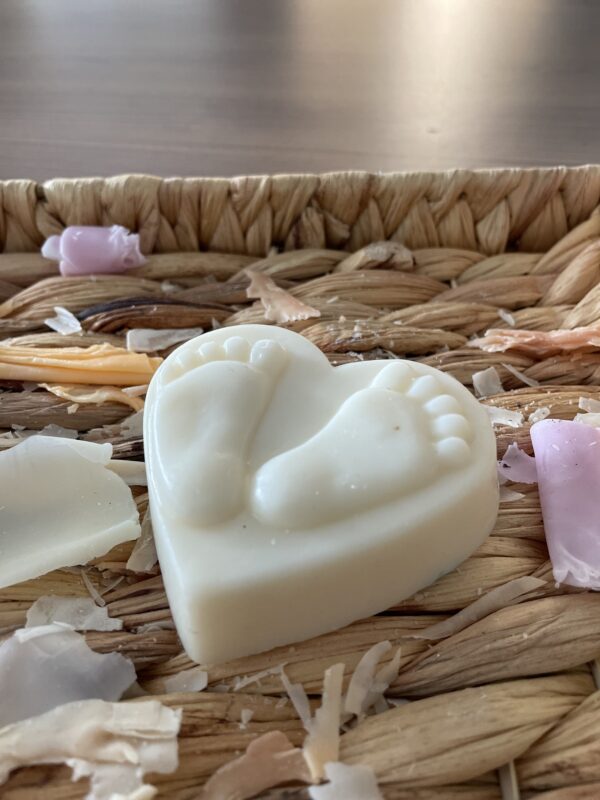 White heart shaped soap with feet on it