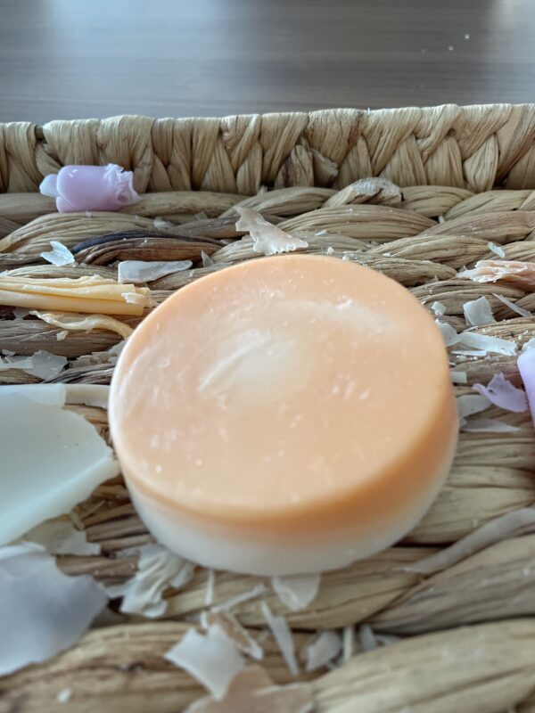 Circular soap that is orange and white
