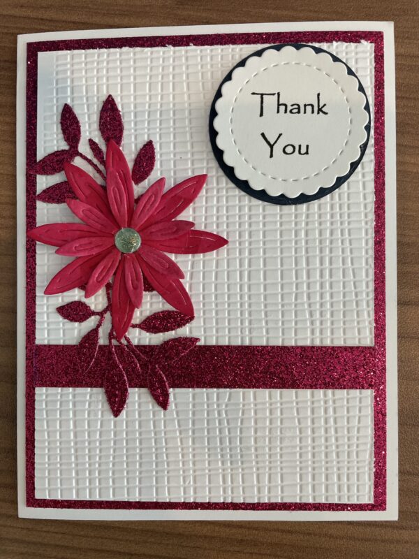 Thank you card with white background and red flowers and red ribbon