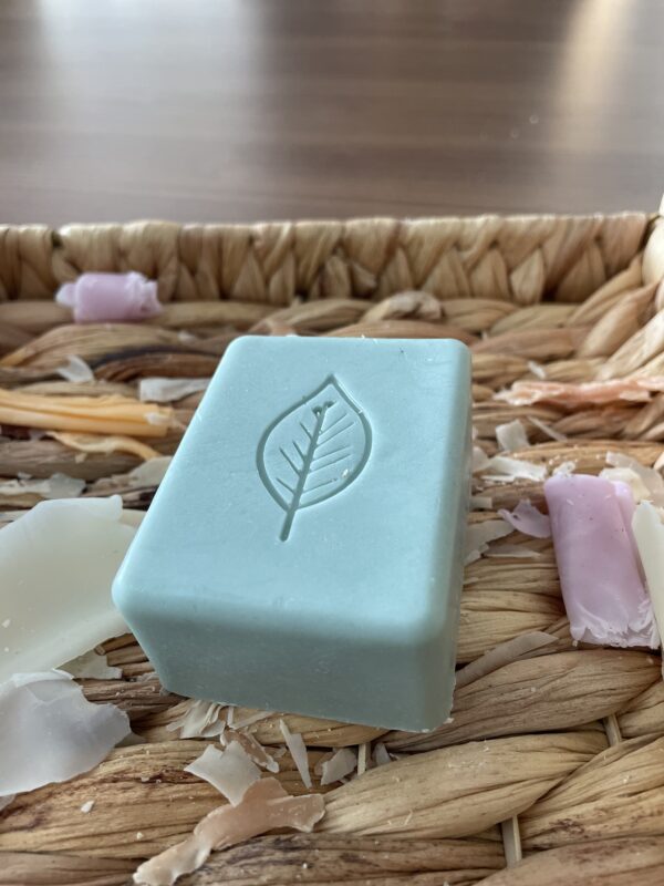 Green bar of soap with leaf on it